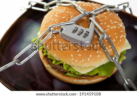 Burger, chained to the plate. Choose healthy food.