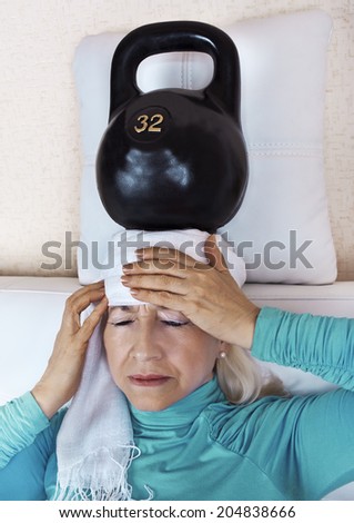 An elderly woman with a headache and weight on your head