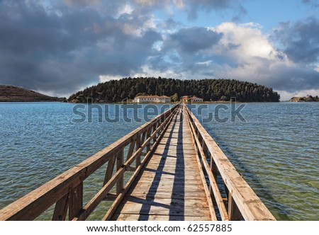 stock-photo-bridge-to-the-zvernec-monastery-vlora-albania-this-is-a-most-important-cultural-monument-in-the-62557885.jpg