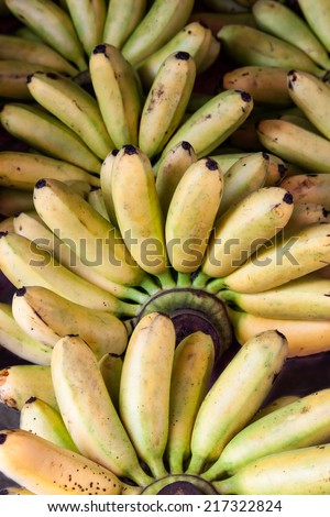 Bunch of ripe small bananas background