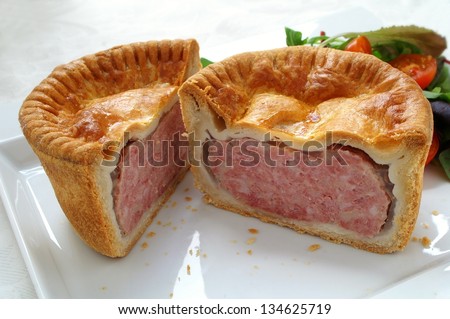 pork pie on plate cut open with salad