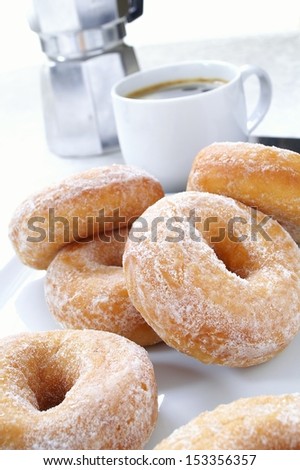 donuts with coffee and maker