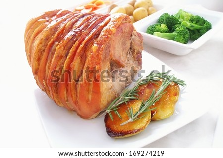 roast pork joint with seasonal vegetables