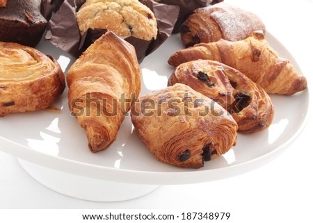pastry and cup cake selection isolated on white platter