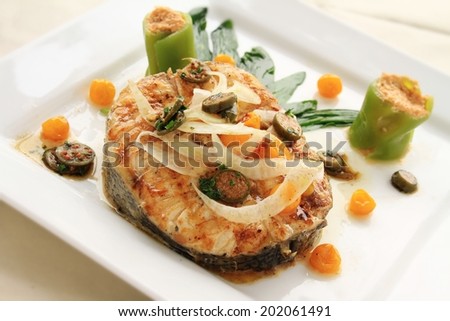 cooked fish steak plated meal