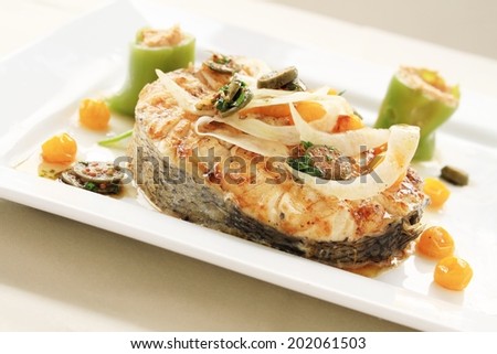 cooked fish steak plated meal