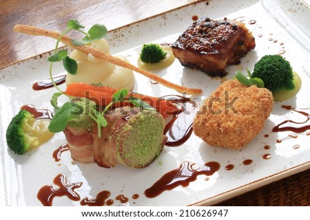 plated pork dinner with vegetables