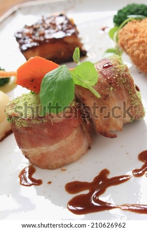 plated pork dinner with vegetables