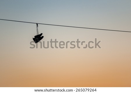 Shoes hanging on a telephone wire