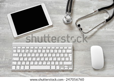 Workplace with tablet and keyboard, and stethoscope