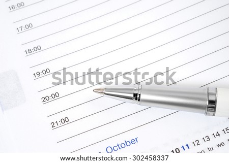 Open notebook and pen for writing