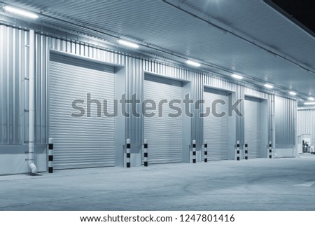 Shutter door or roller door and concrete floor outside factory building for industrial background.