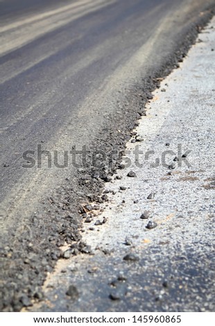 Layer of asphalt road in repair work.