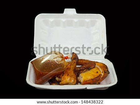 Roasting chicken in styrofoam box with isolate background.