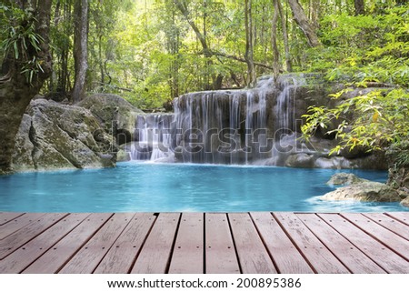 Scenery of Waterfall with wood deck.