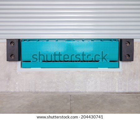 Dock leveler and shutter door,  use for product transfer  to truck.