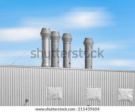 Ventilation system of factory with blue sky background.
