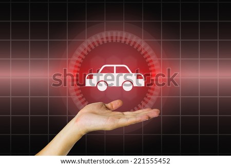 Model of car in hand on modern dark background.