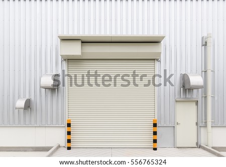Shutter door or roller door and concrete floor outside factory building use for industrial background.