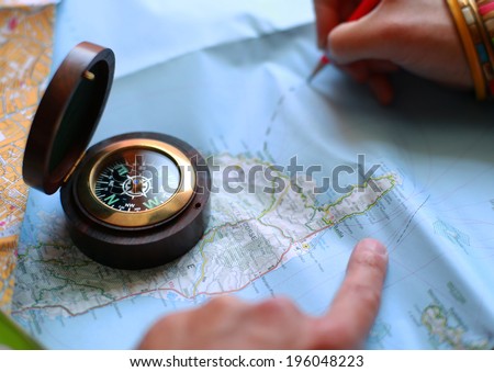 Route on the map with the help of a compass, travel