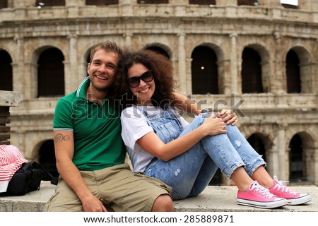 Tourists on the background of Colosseum, Roman holiday