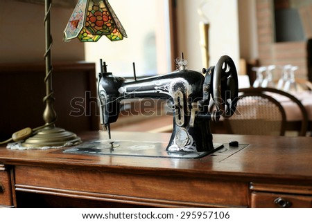 Black retro sewing machine in an old house