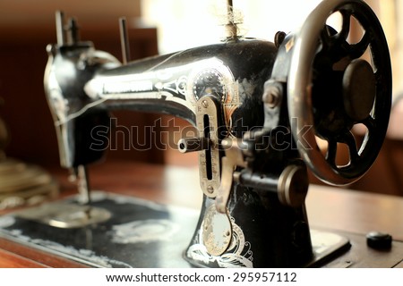 Black retro sewing machine in an old house