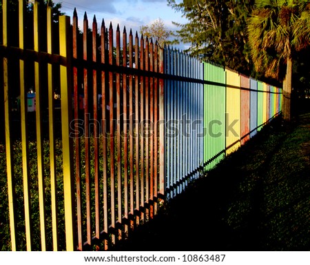Yellow red blue green playground fence.