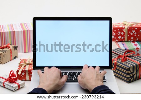 Man buying christmas gifts online - online shopping concept