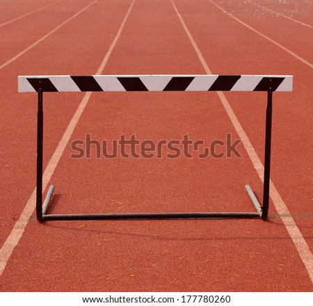 a hurdles on red running tracks