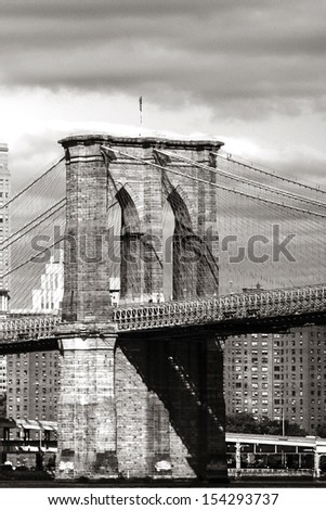 Black and white view of Brooklyn Bridge from the Hudson River, New York
