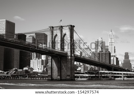 view of Brooklyn Bridge and skyscrapers from the Hudson River, New York, Black and white