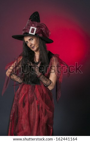Halloween witch with attitude on dark background