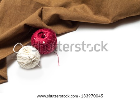 accessories for sewing with a rough cloth on a white background