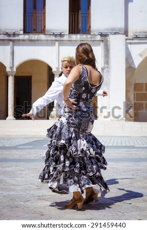 Couple of flamenco dancers dancing outside