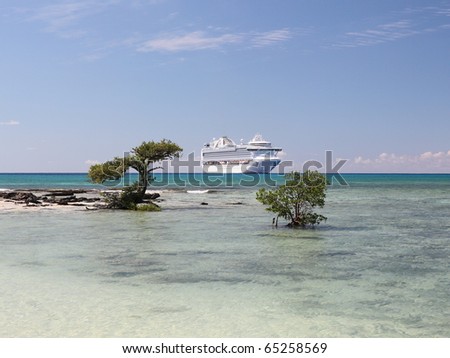 A ship waits on the horizon of Caribbean sea
