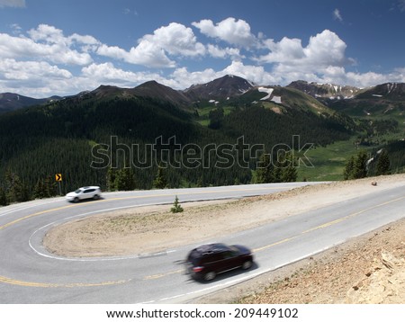 Motion blurred cars in Rocky Mountain park, Colorado