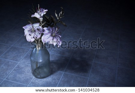 Wilting flowers with dramatic lighting