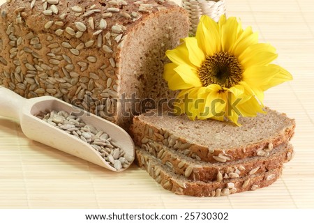 Sliced multi grain bread with seeds and sunflower blossom