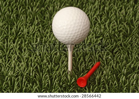 A white golf ball on a tee. A macro image.