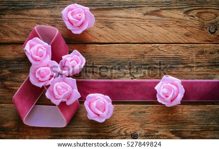 International women\'s day card, velvet ribbon, pink roses on old wooden boards, 8 March composition