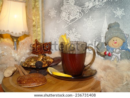 Black tea with lemon and spices , rum balls and cakes with seeds