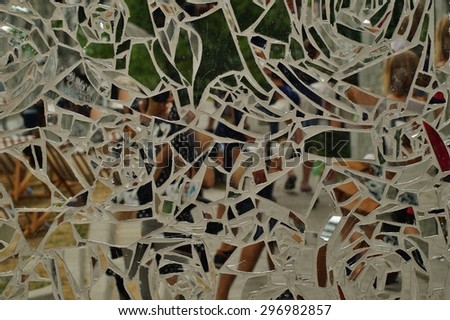 Glossy wall with  pieces of broken mirror