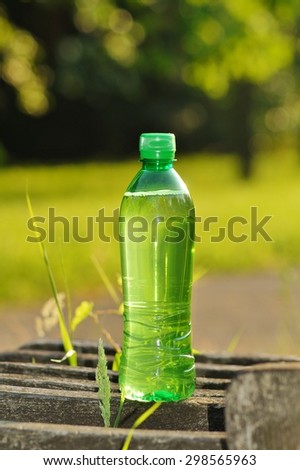 Drink in a green plastic bottle on a hot day