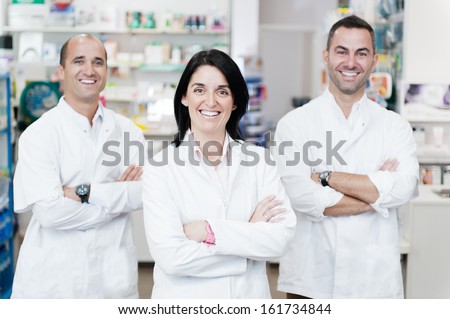 Portrait of a pharmaceutical team. They are in a real pharmacy