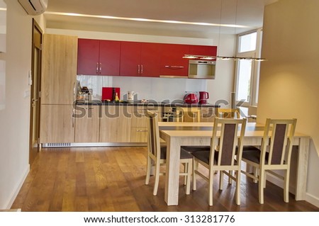 Living room with kitchen site and dining-table in renovated apartment with modern LED lighting  in Sofia, Bulgaria