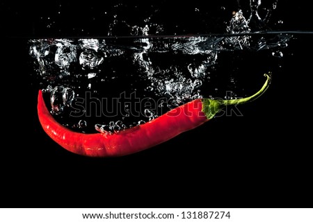 Red Peppers  Splashing In Water