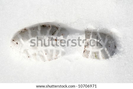 Footprint in white snow, trace of footstep