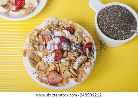 Seen from above Bowl full of cereal, fruit, yogurt and chia