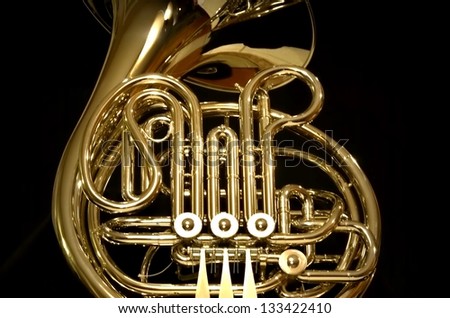 Isolated French horn on black background